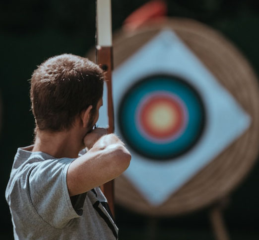 Man aiming at target